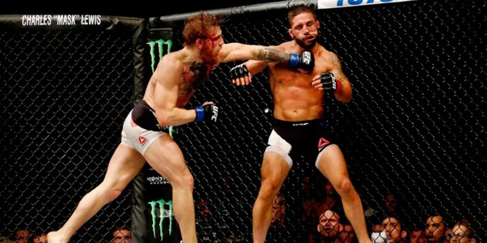 Imagem ilustrativa da imagem McGregor choca o mundo, nocauteia e desafia José Aldo