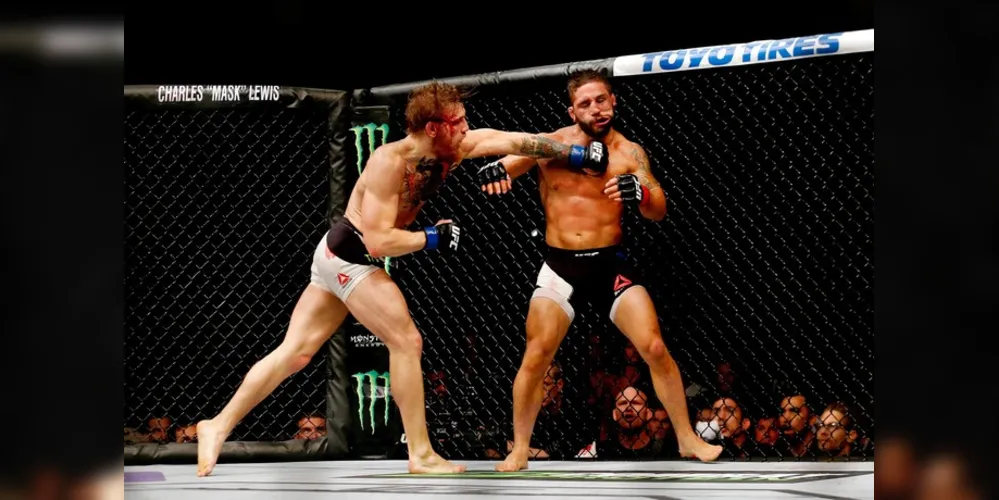 Imagem ilustrativa da imagem McGregor choca o mundo, nocauteia e desafia José Aldo
