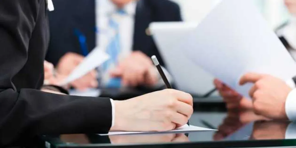 Business - meeting in an office, lawyers or attorneys discussing a document or contract agreement