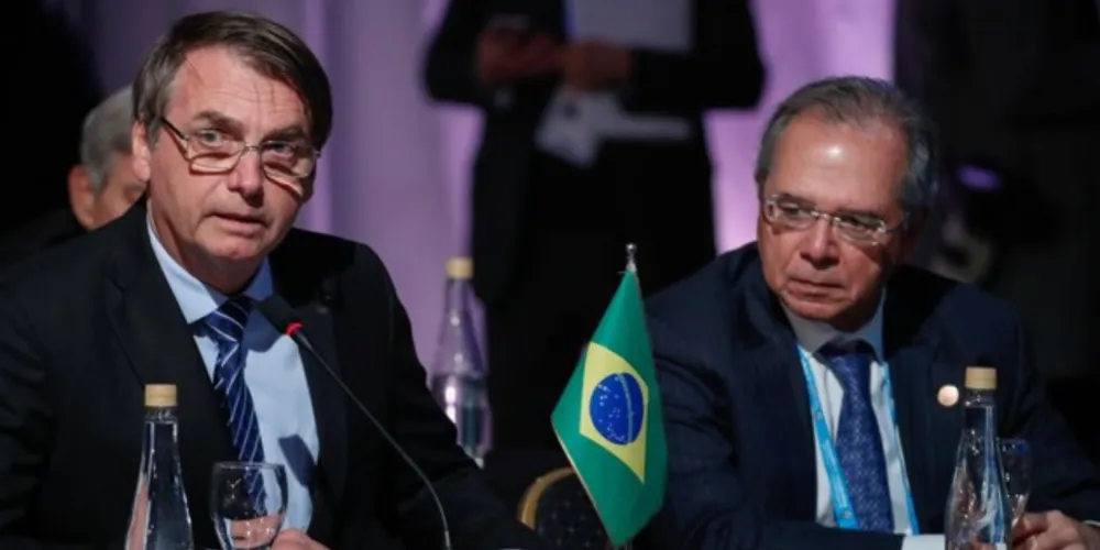 Presidente Bolsonaro (sem partido) e o ministro da Economia Paulo Guedes.