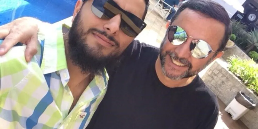 Adilson Simões (direita) ao lado do filho Eduardo