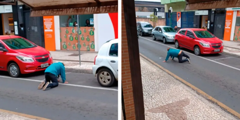 Homem embriagado engatinha para atravessar a Rua XV de Novembro
