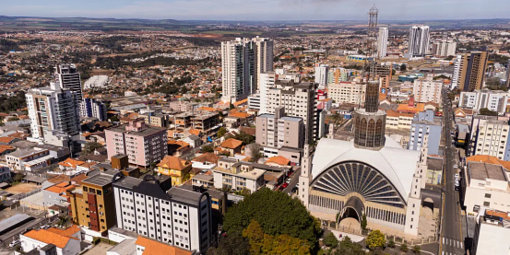 Aerial view of the city of Ponta Grossa with its buildings and Santana Cathedral, on a sunny day.