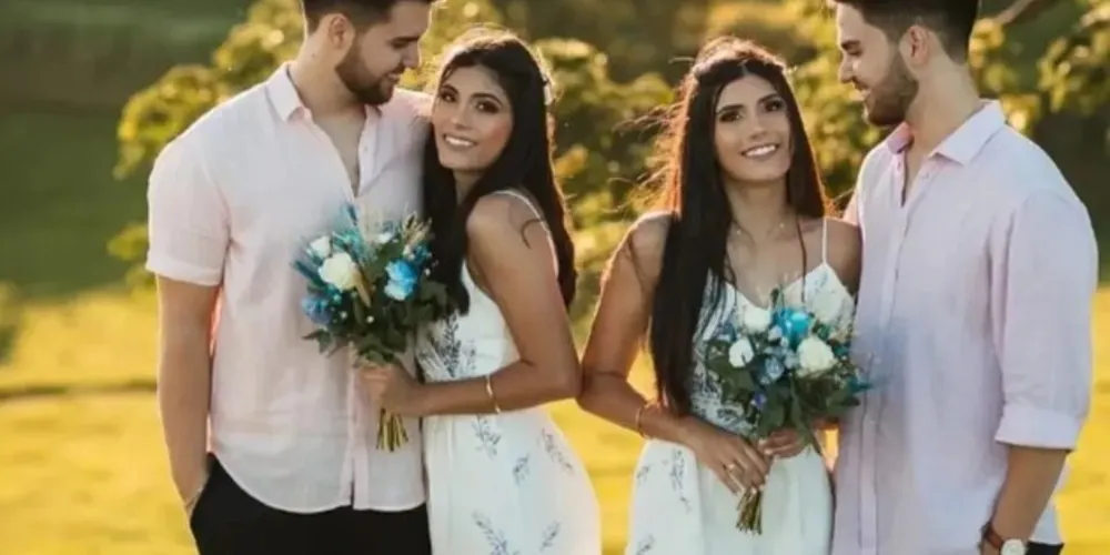 Em vídeo publicado no Instagram, Larissa e Letícia aparecem com o mesmo vestido branco segurando um buquê