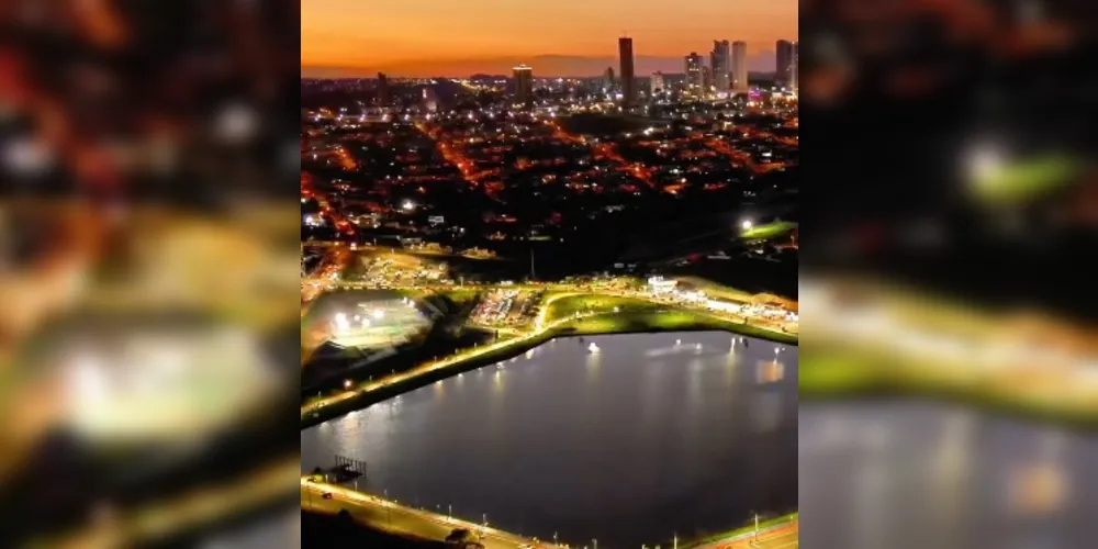 Lago de Olarias aparece em destaque e prédios contrastam com o pôr do sol