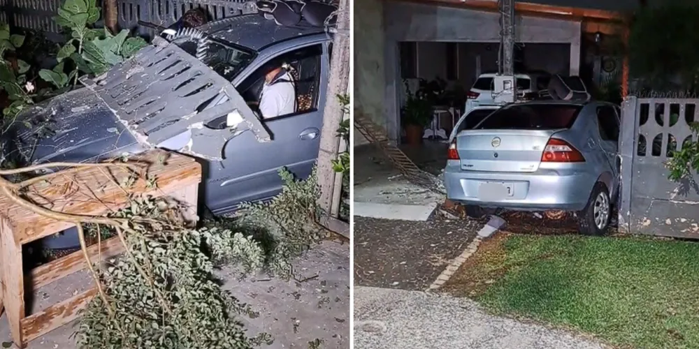 O carro, um Prisma, invadiu um terreno e ficou preso entre um poste e um muro