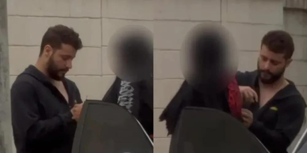Marcos Phelipe de Barros aparece mostrando o medicamento para a mulher antes de fazer a aplicação na calçada