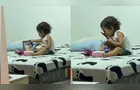 Criança emociona ao brincar e dar beijos em foto de irmã que morreu