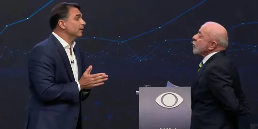Flávio Bolsonaro (PL) e Luiz Inácio Lula da Silva (PT) em debate da Band