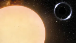 Impressão artística do buraco negro (no topo, à direita) e sua estrela vizinha, a apenas 1600 anos-luz de distância da Terra.
