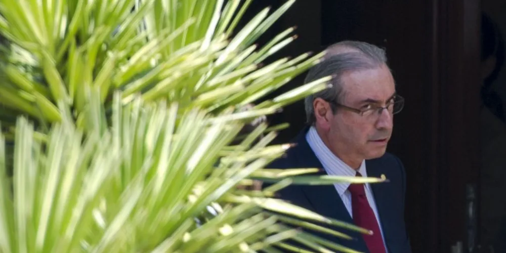 Imagem ilustrativa da imagem Após buscas da PF, Cunha descarta renúncia e critica PT